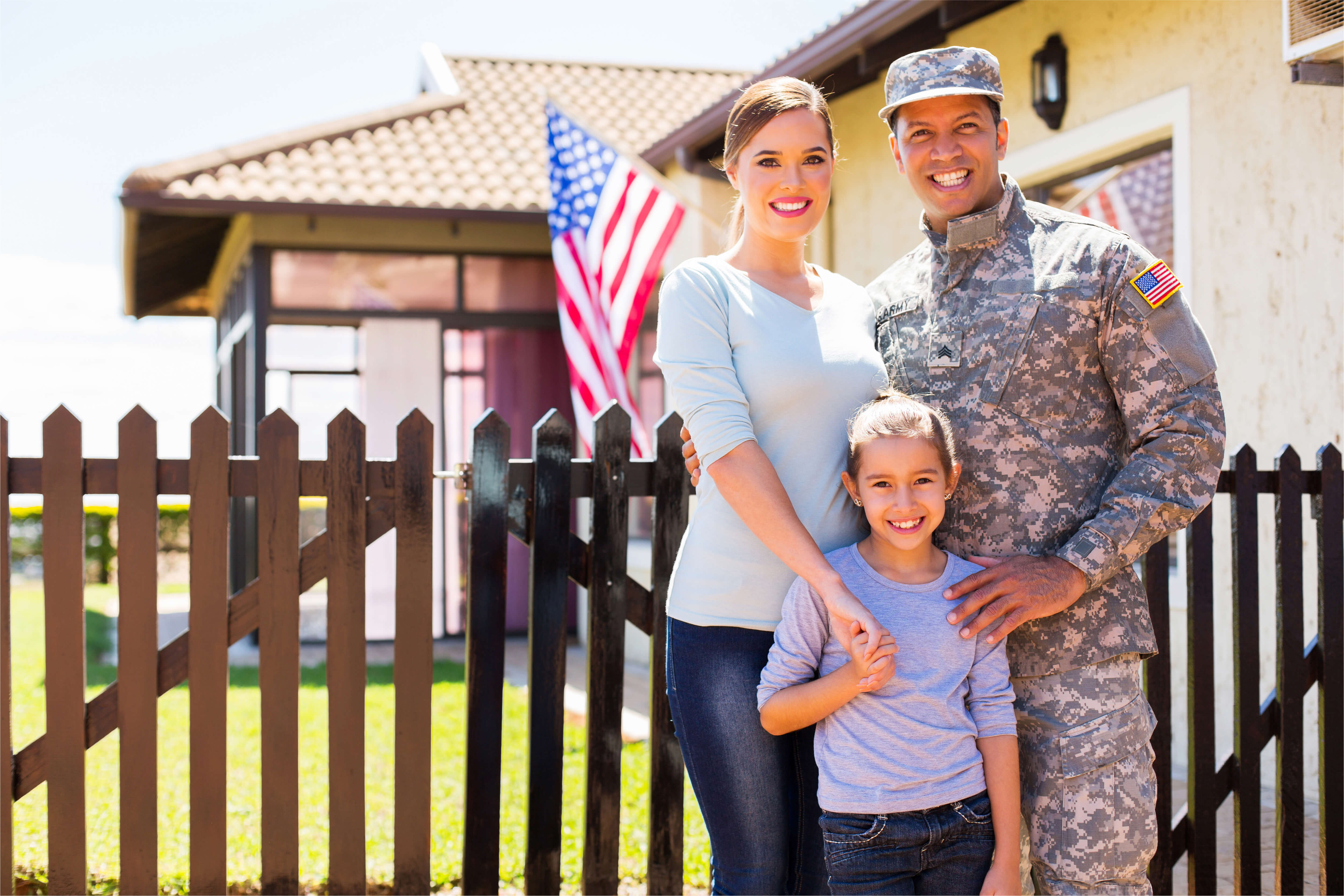 Veteran's family with home.